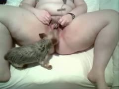 Her hot pussy is licked by her beloved dog.